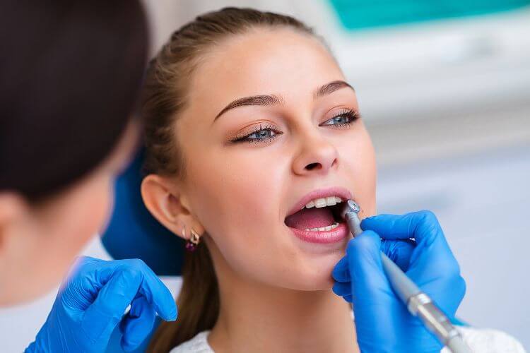cosmetic dentistry changing lives woman at the dentist