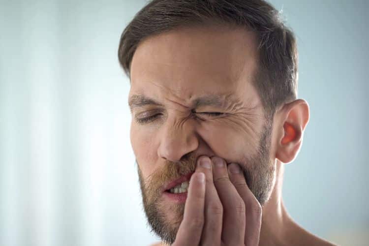 why does preventative dentistry matter man holding jaw with hurting teeth