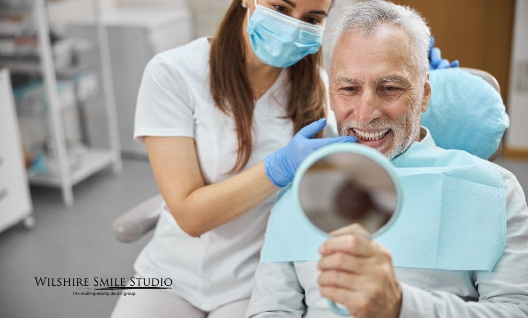 old man getting dental implants